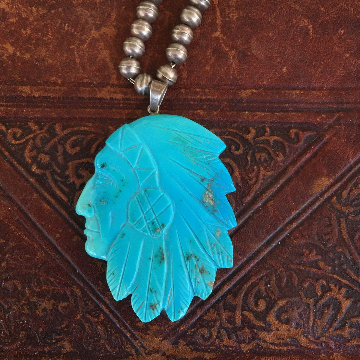 Vintage Navajo Carved Turquoise Chief Pendant